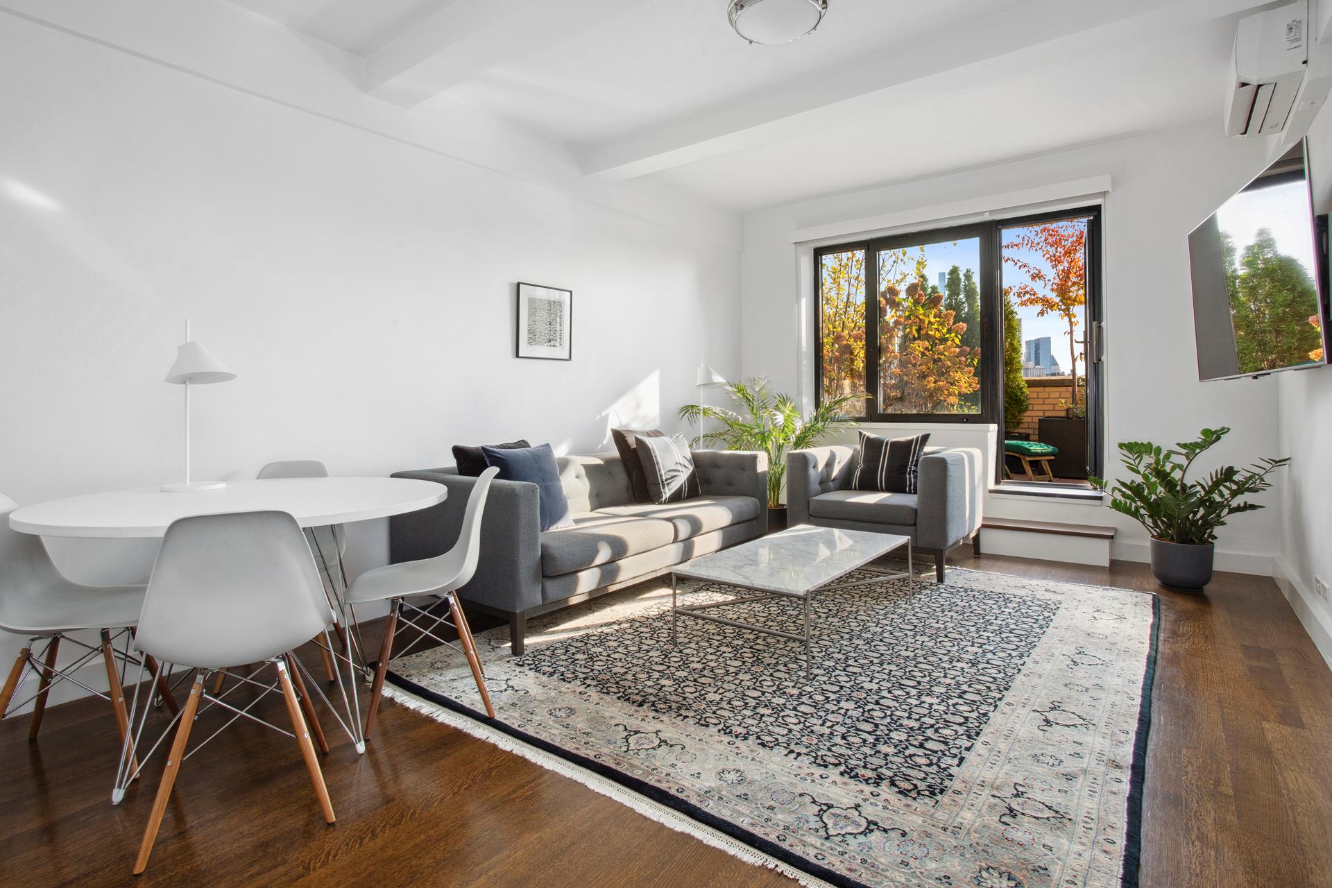 a living room with furniture and a table