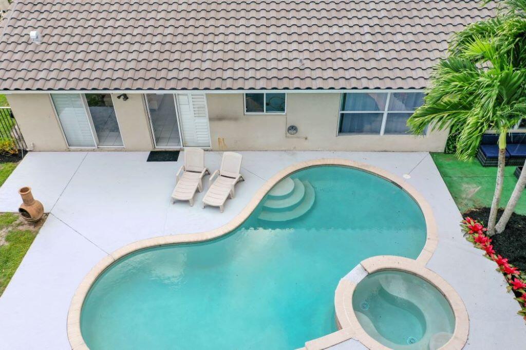 a view of a swimming pool with a balcony