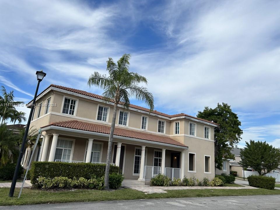 a front view of residential houses with yard