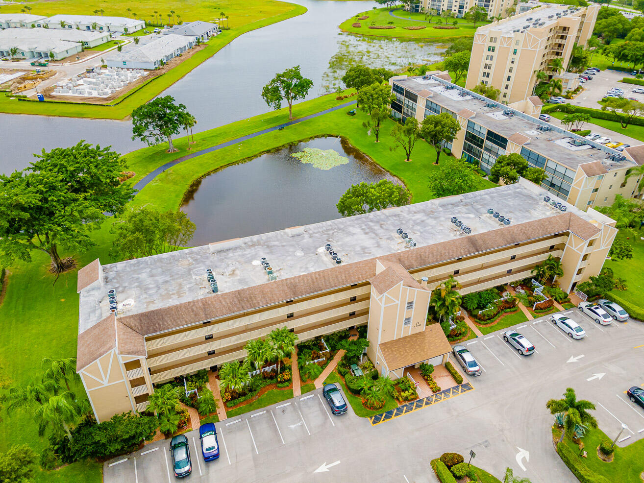 an aerial view of a house with a yard and outdoor seating