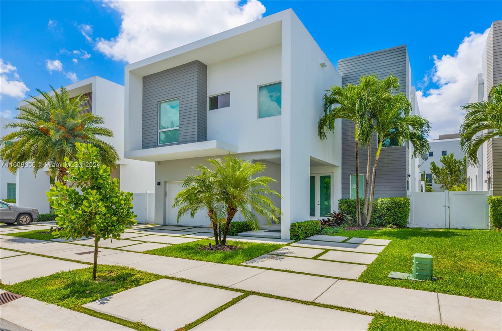 a house with palm tree in front of it