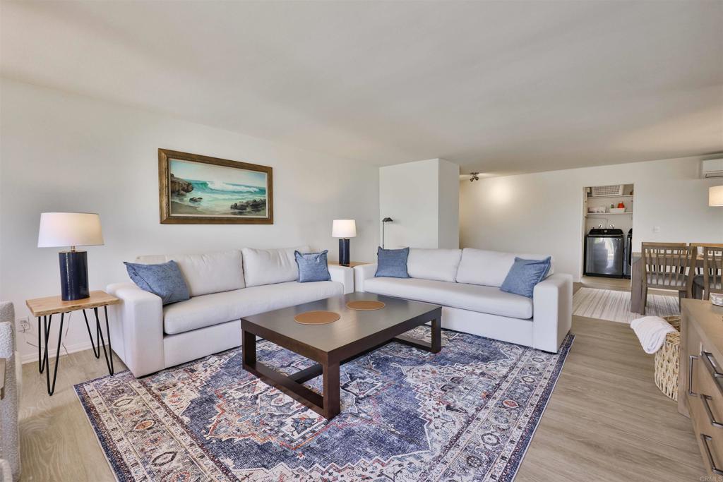 a living room with furniture and a rug