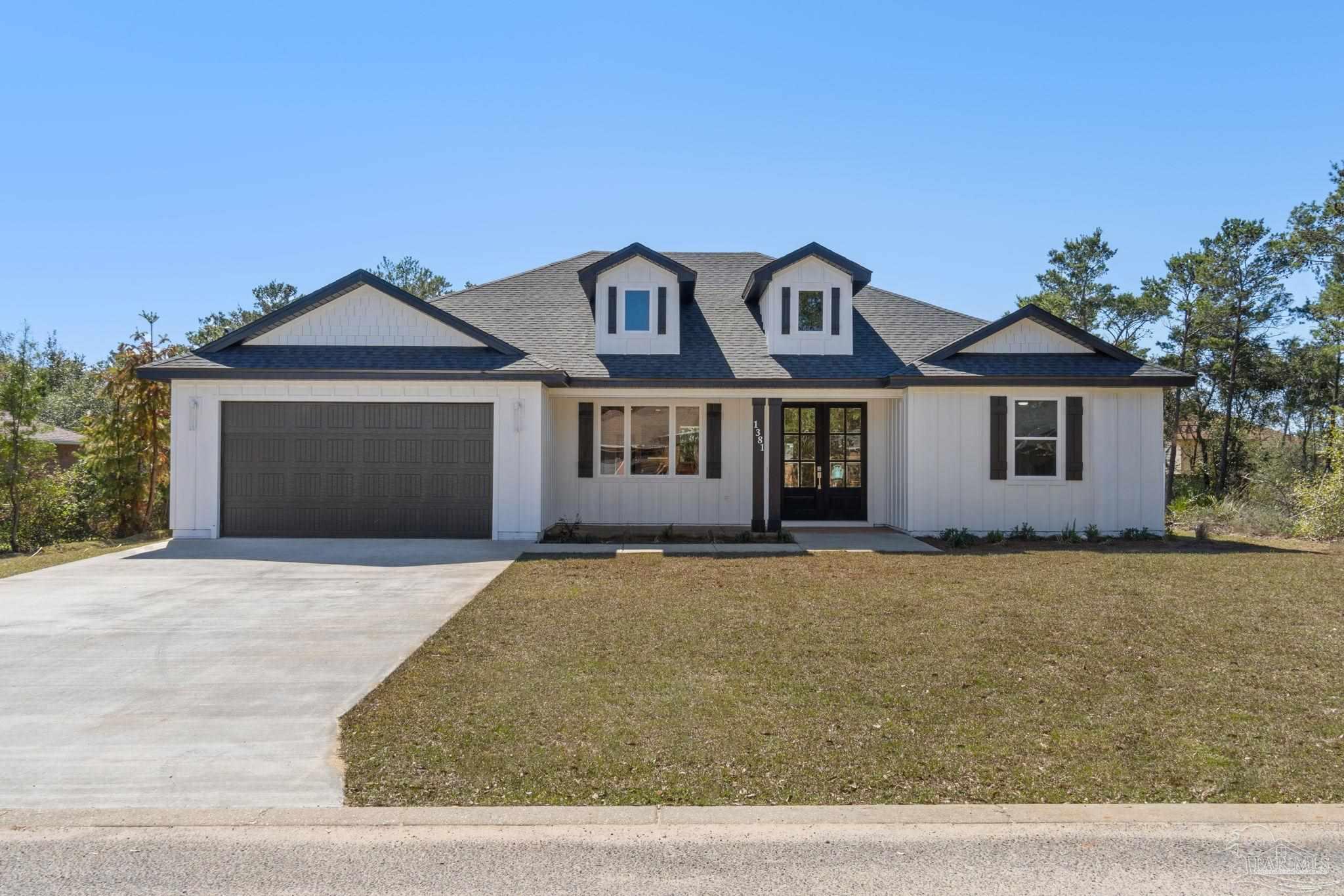 a front view of a house with yard