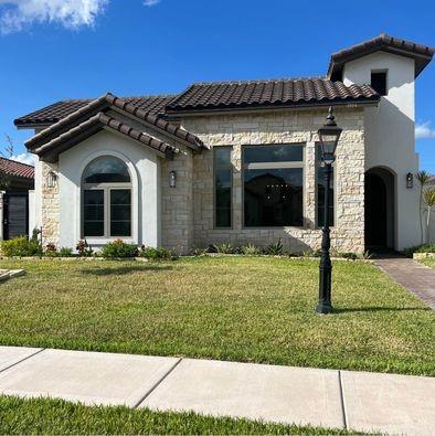 front view of a house with a yard