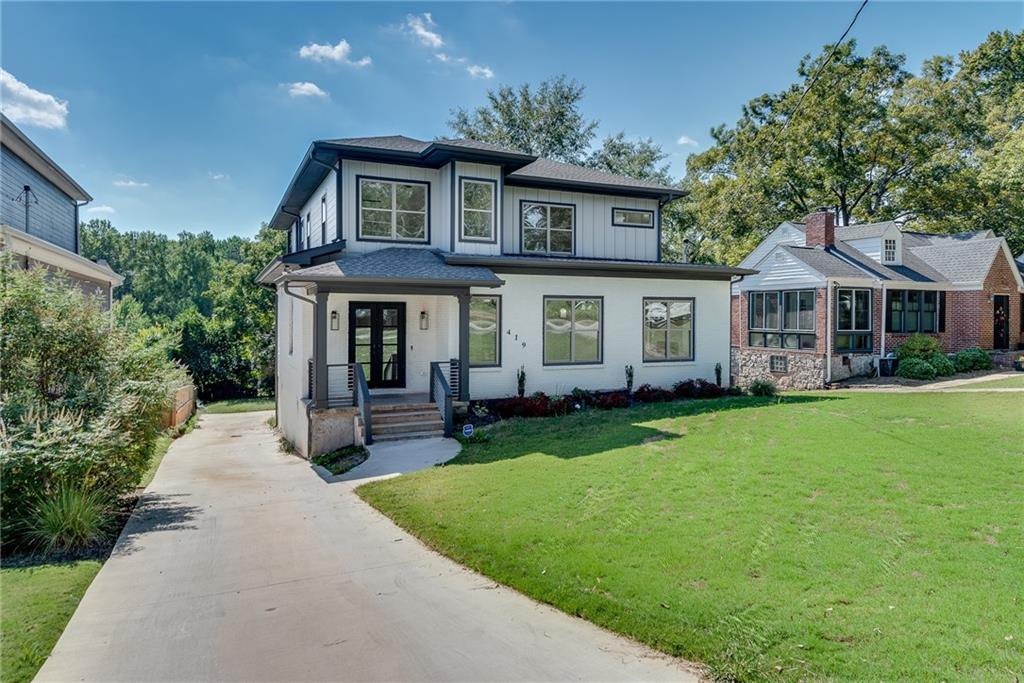 a front view of a house with a garden and porch