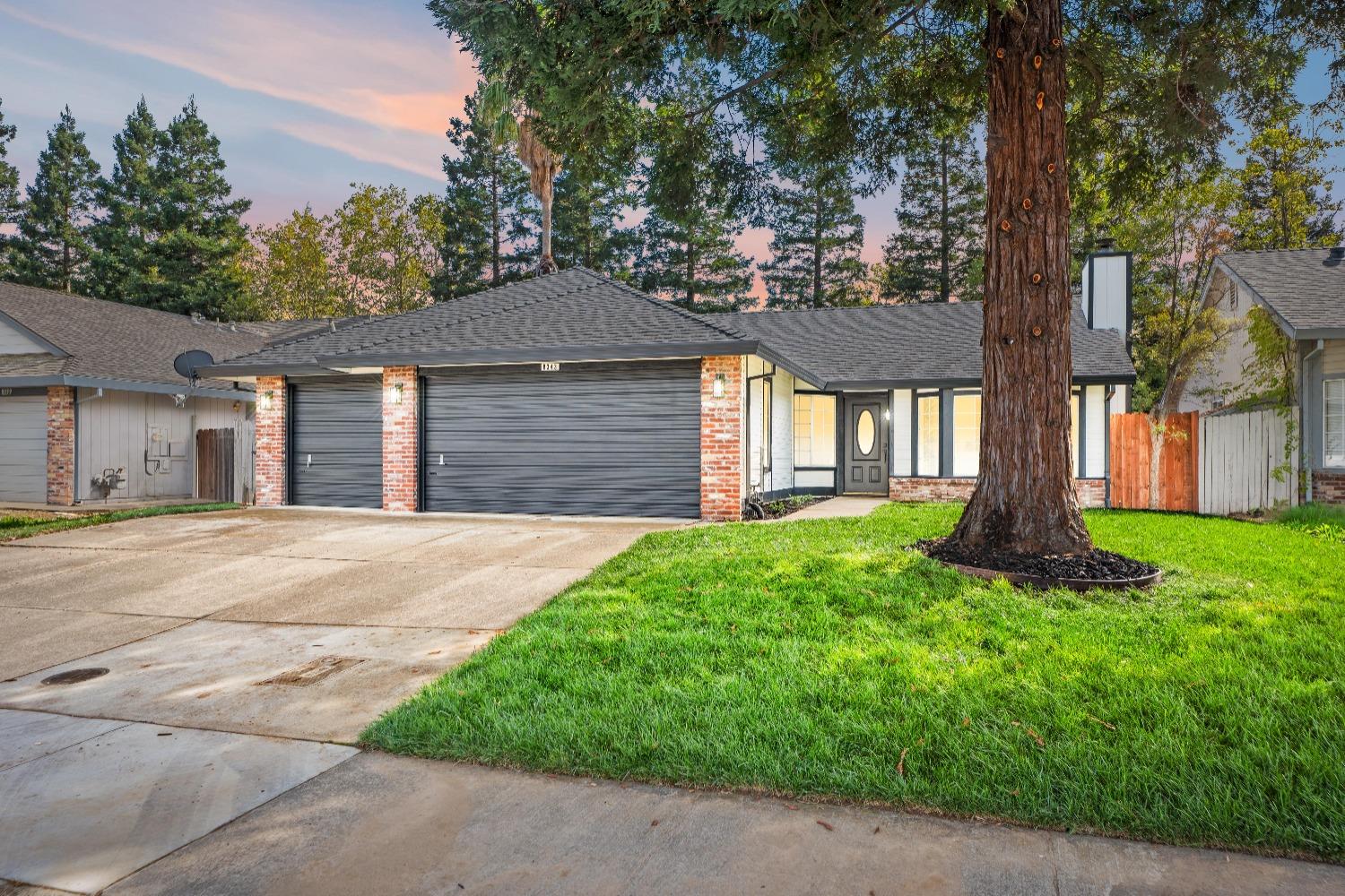 front view of a house with a yard