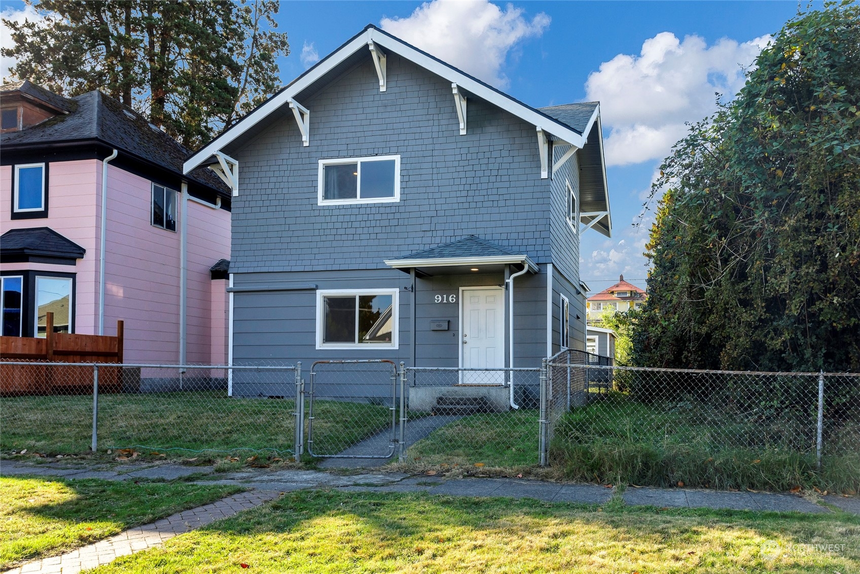 a front view of a house with a yard