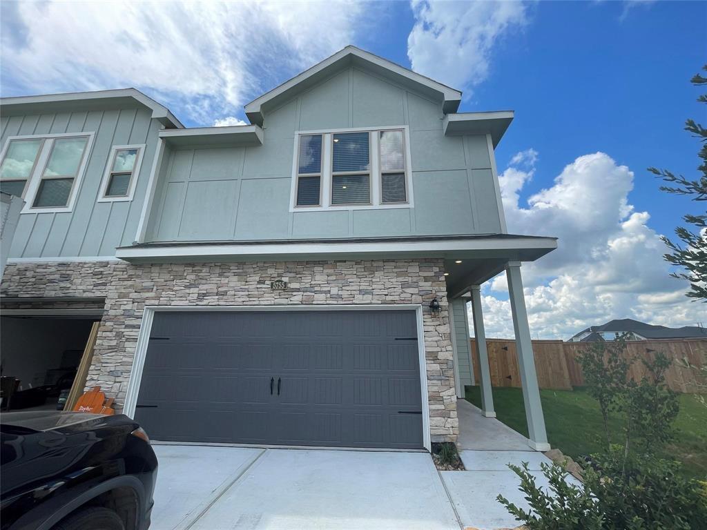 a front view of a house with a garage