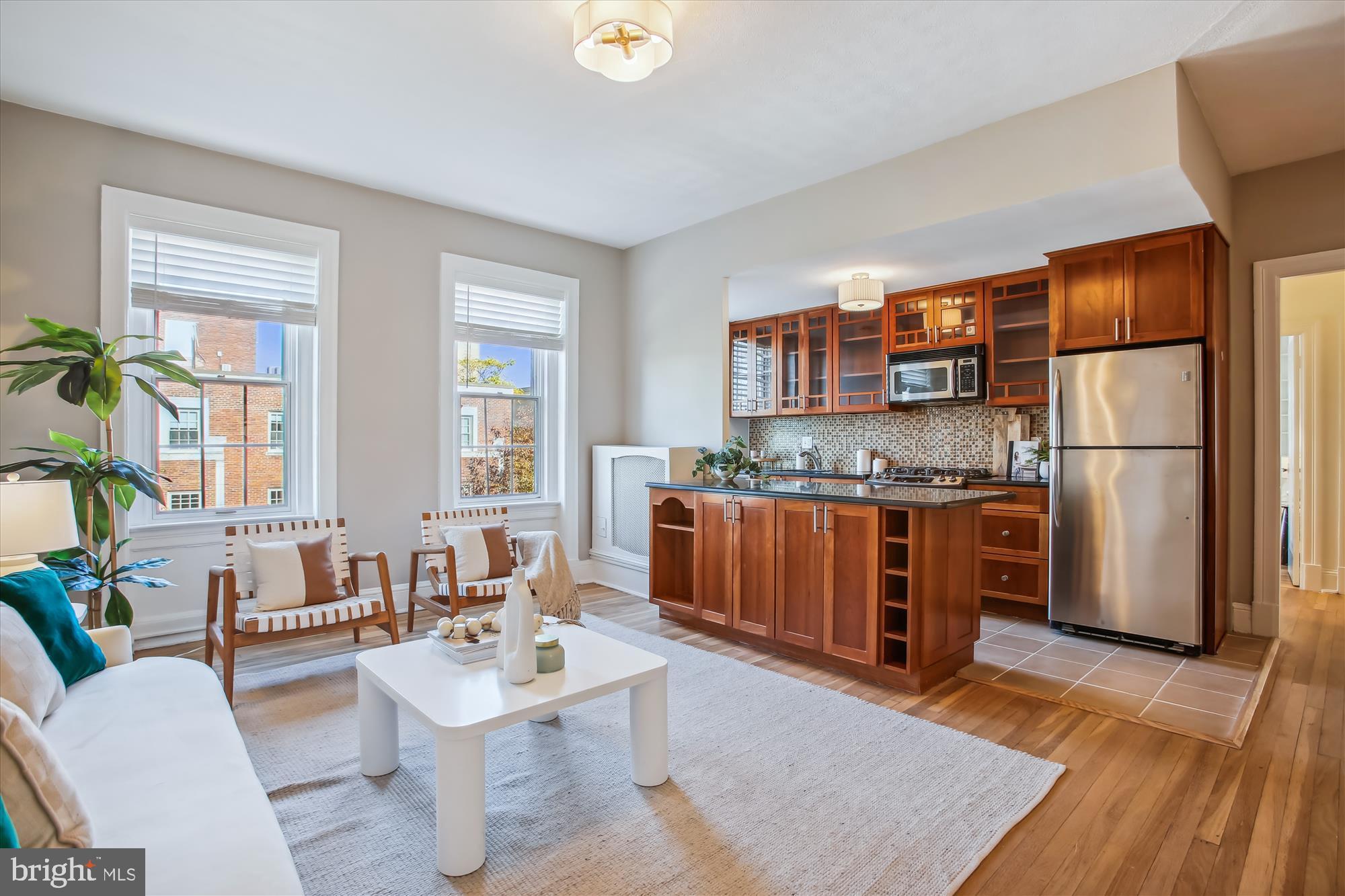 a living room with a couch and a dining table