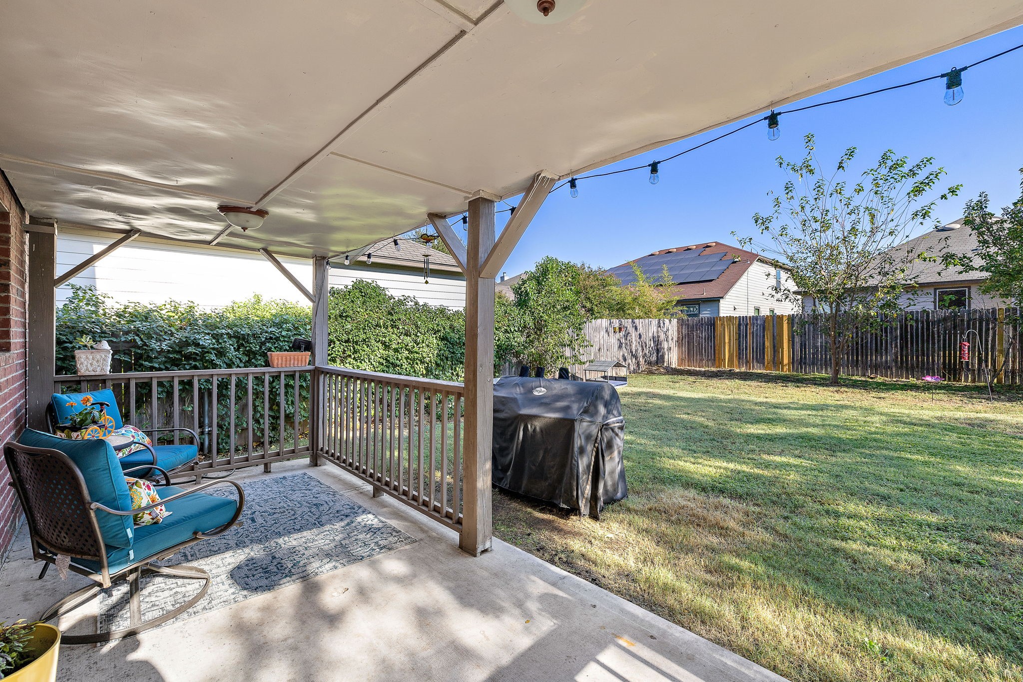 a view of a chair and tables in the patio