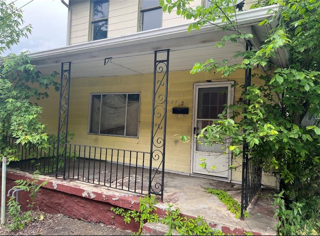 a view of a house with a small garden