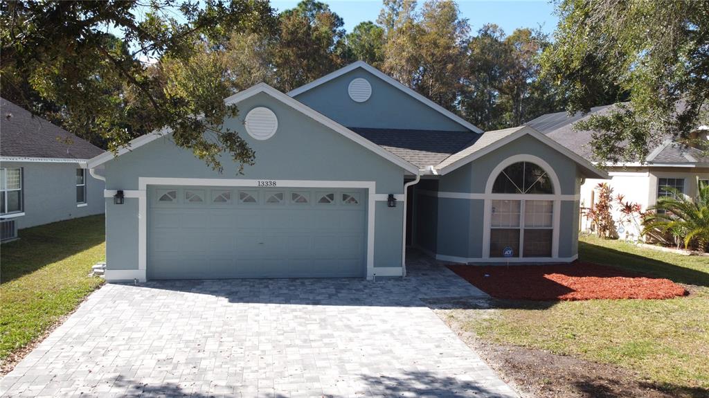 a front view of a house with yard