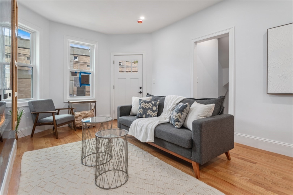 a living room with furniture and a table