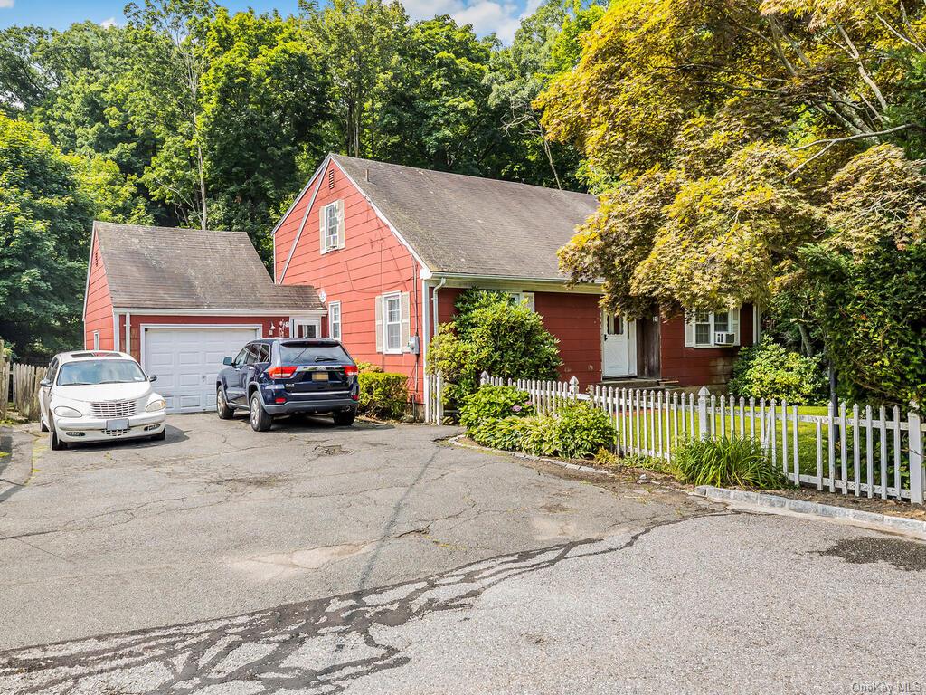 View of front of property with a garage