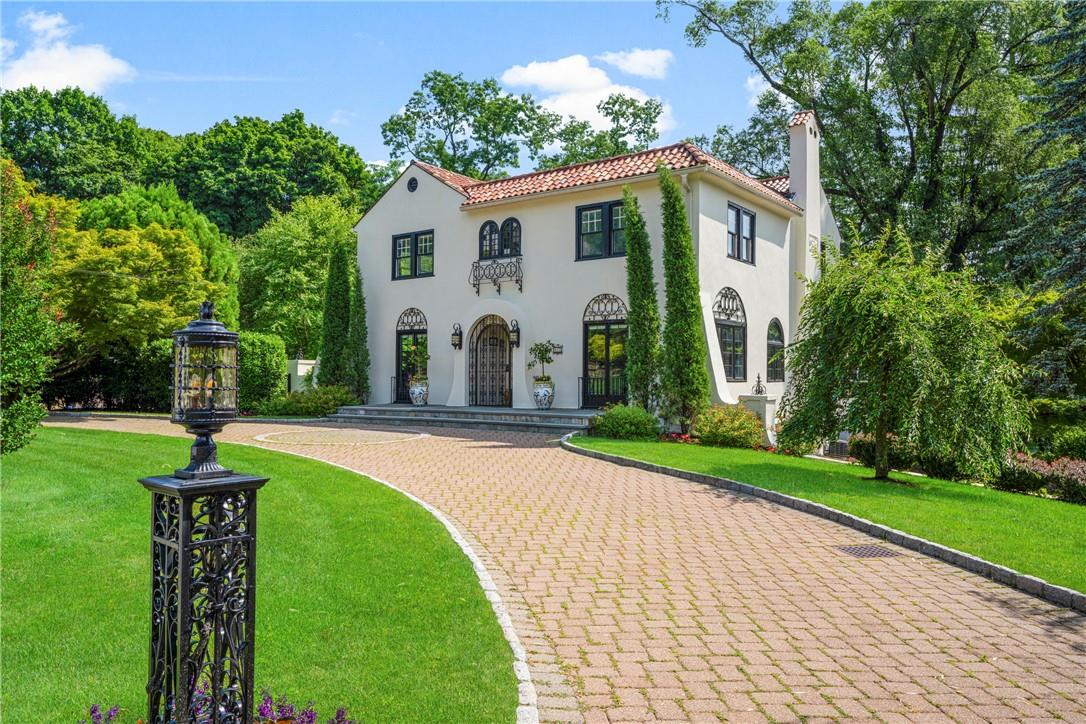 a front view of house with yard and green space