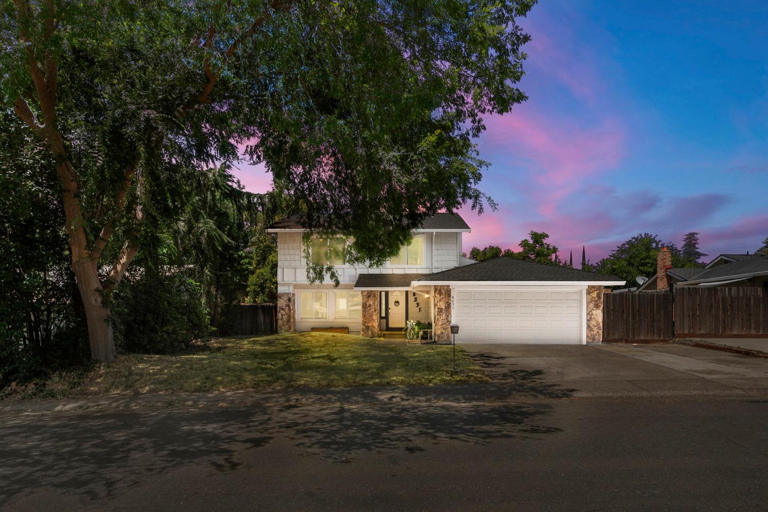 a view of a house with a yard