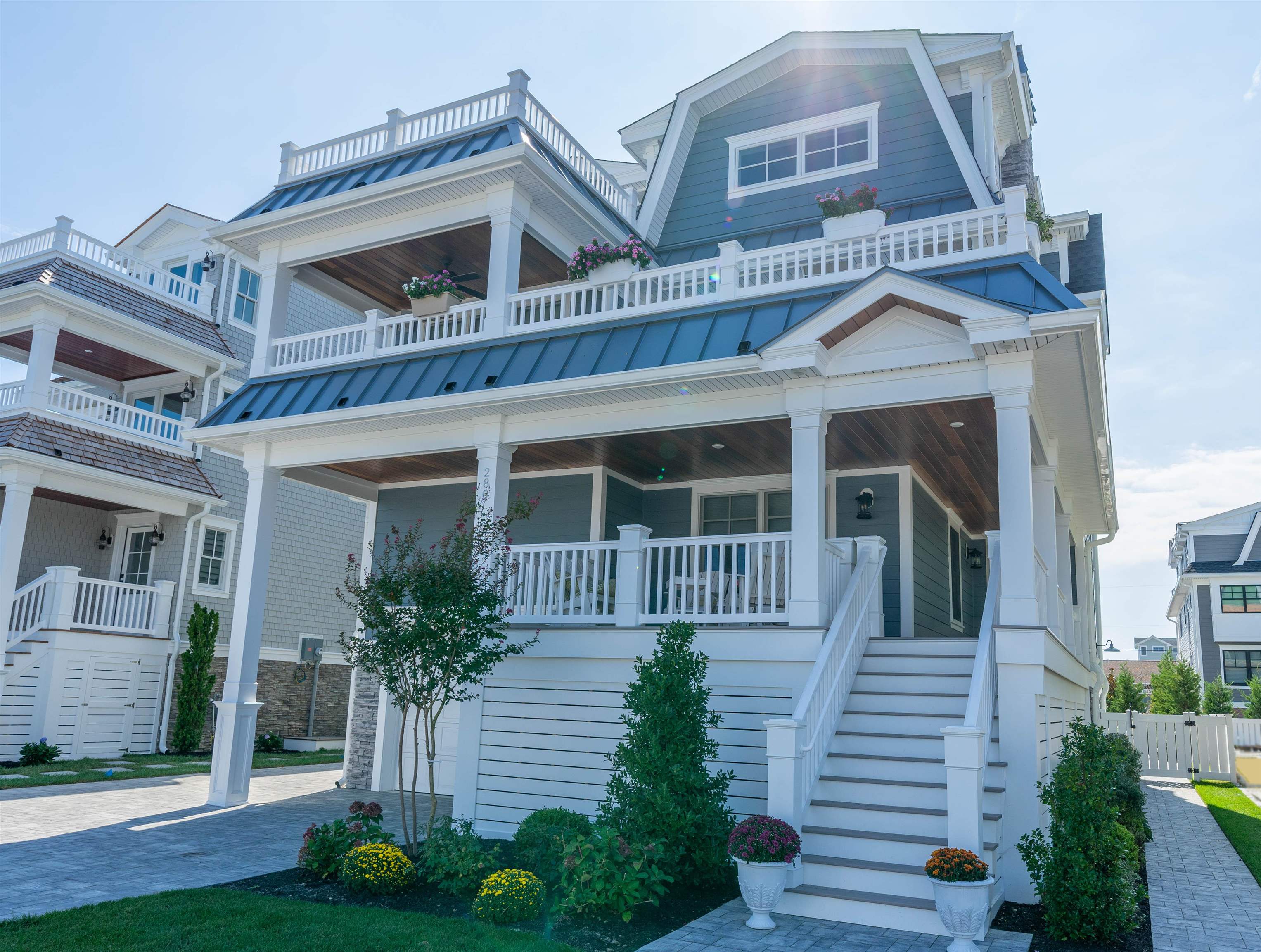 a front view of a house with a garden