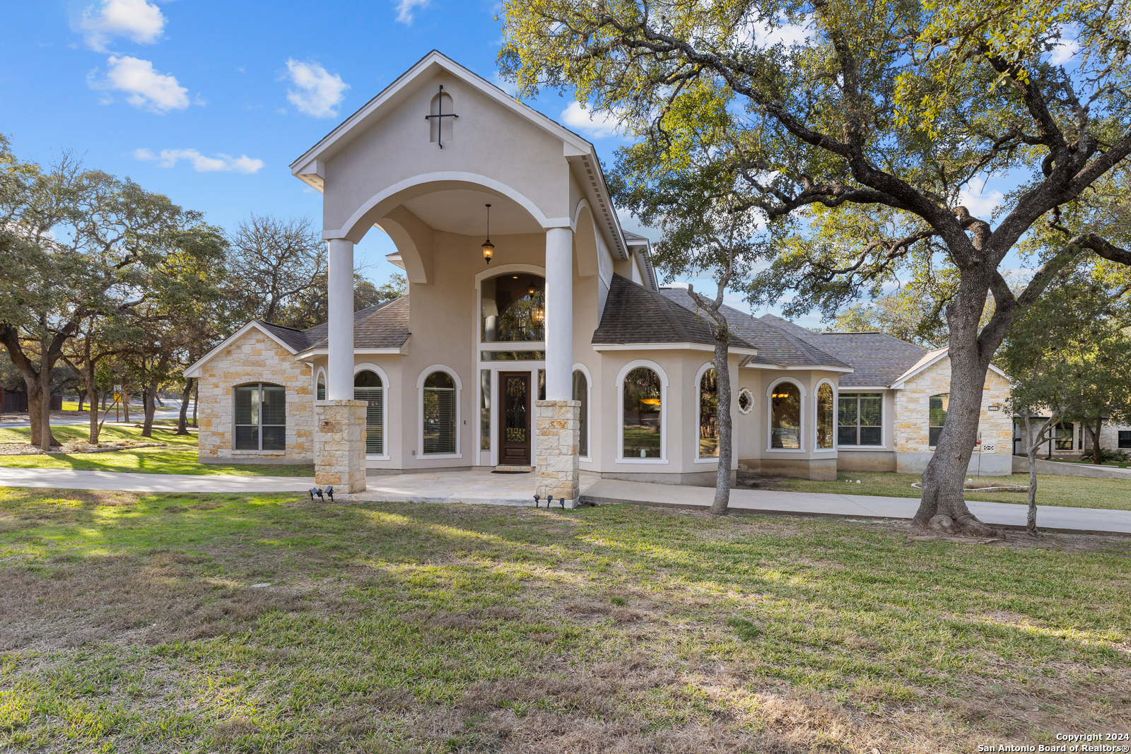 a front view of a house with a yard