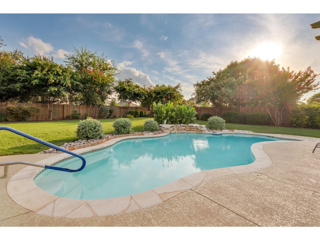 This home offers a stunning backyard with an in-ground pool on a sprawling nearly 1/3 acre lot.