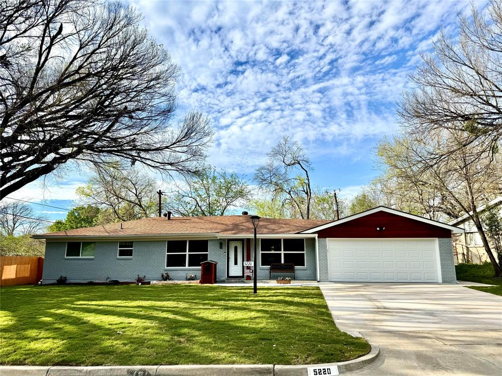 a front view of a house with yard