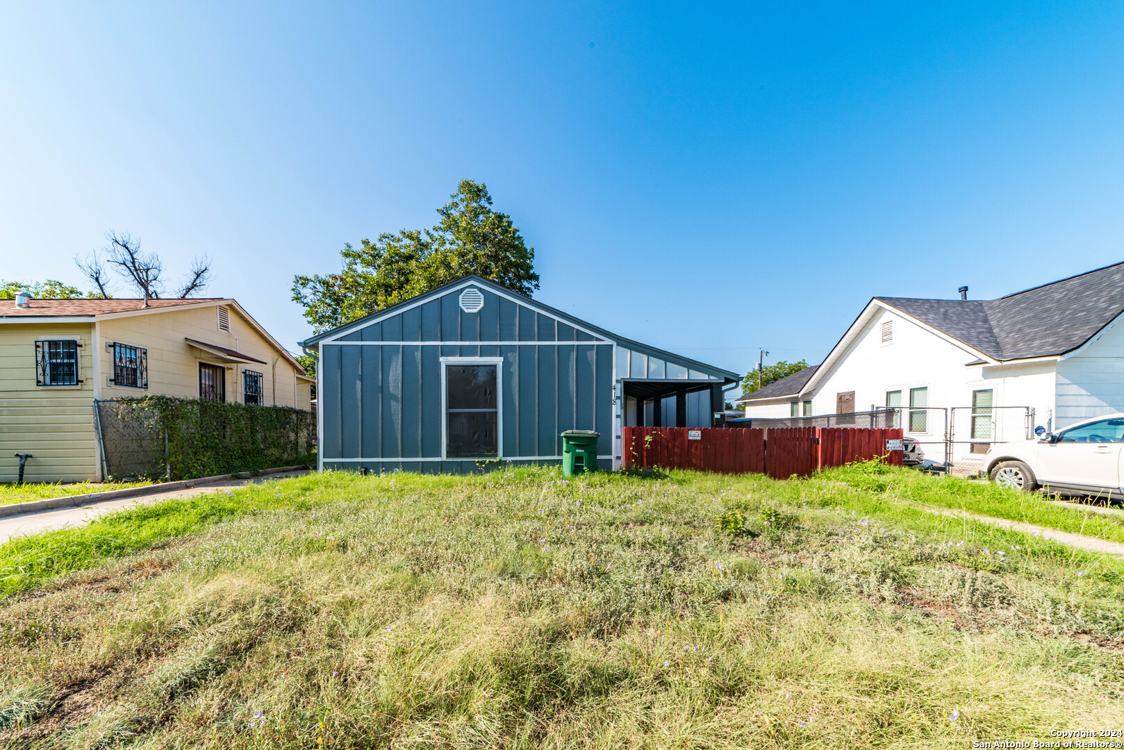 a house that has a big yard in front of it