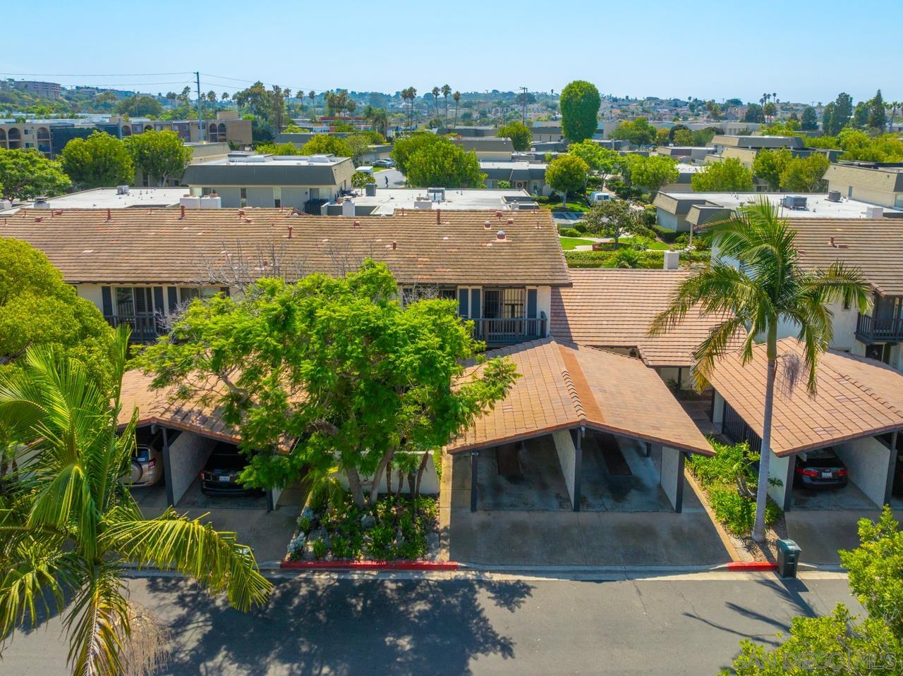 an aerial view of a house with yard swimming pool and outdoor seating