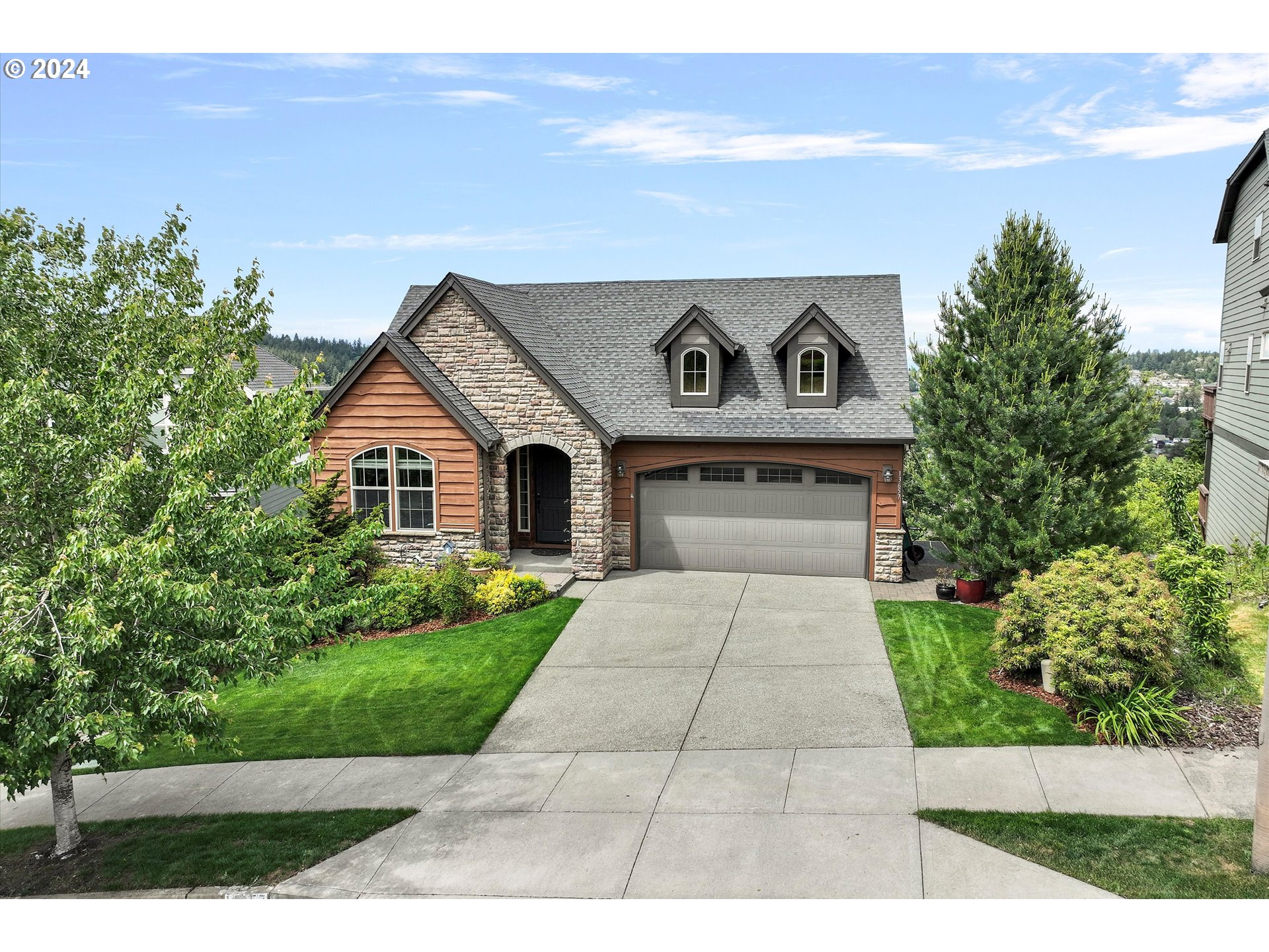 a front view of a house with yard