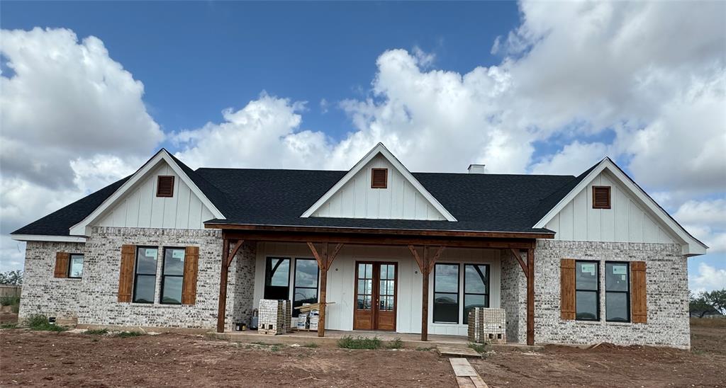 a front view of a house with yard