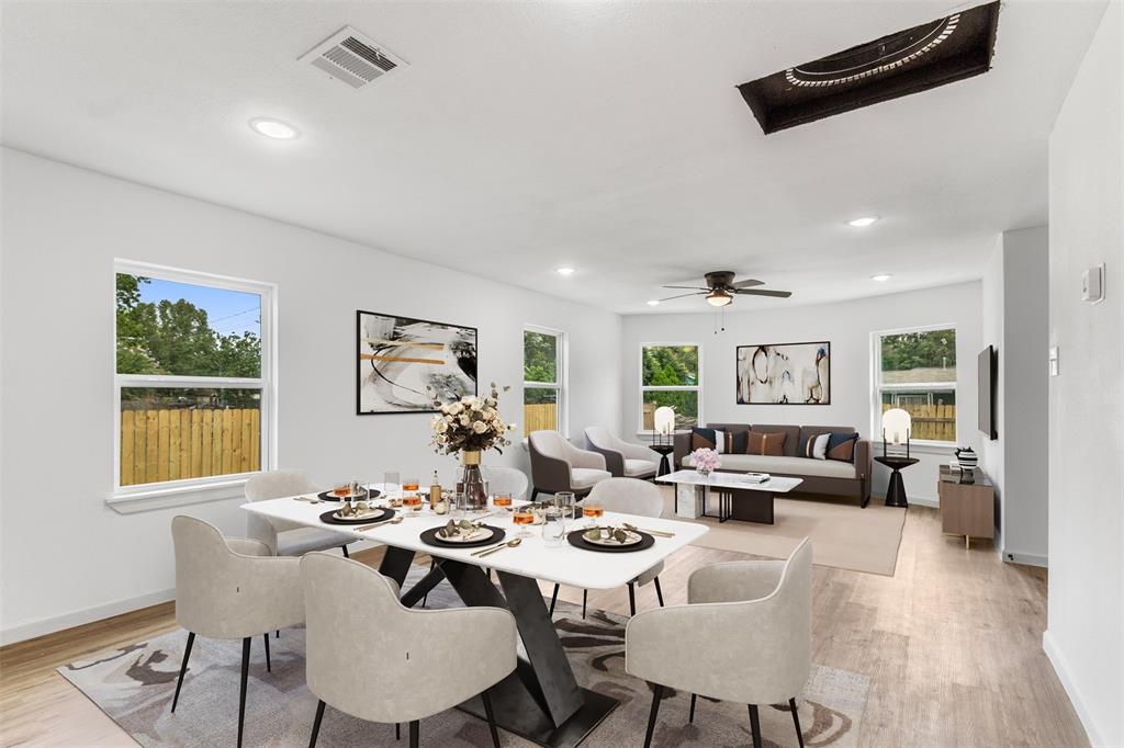 a view of a dining room with furniture and wooden floor