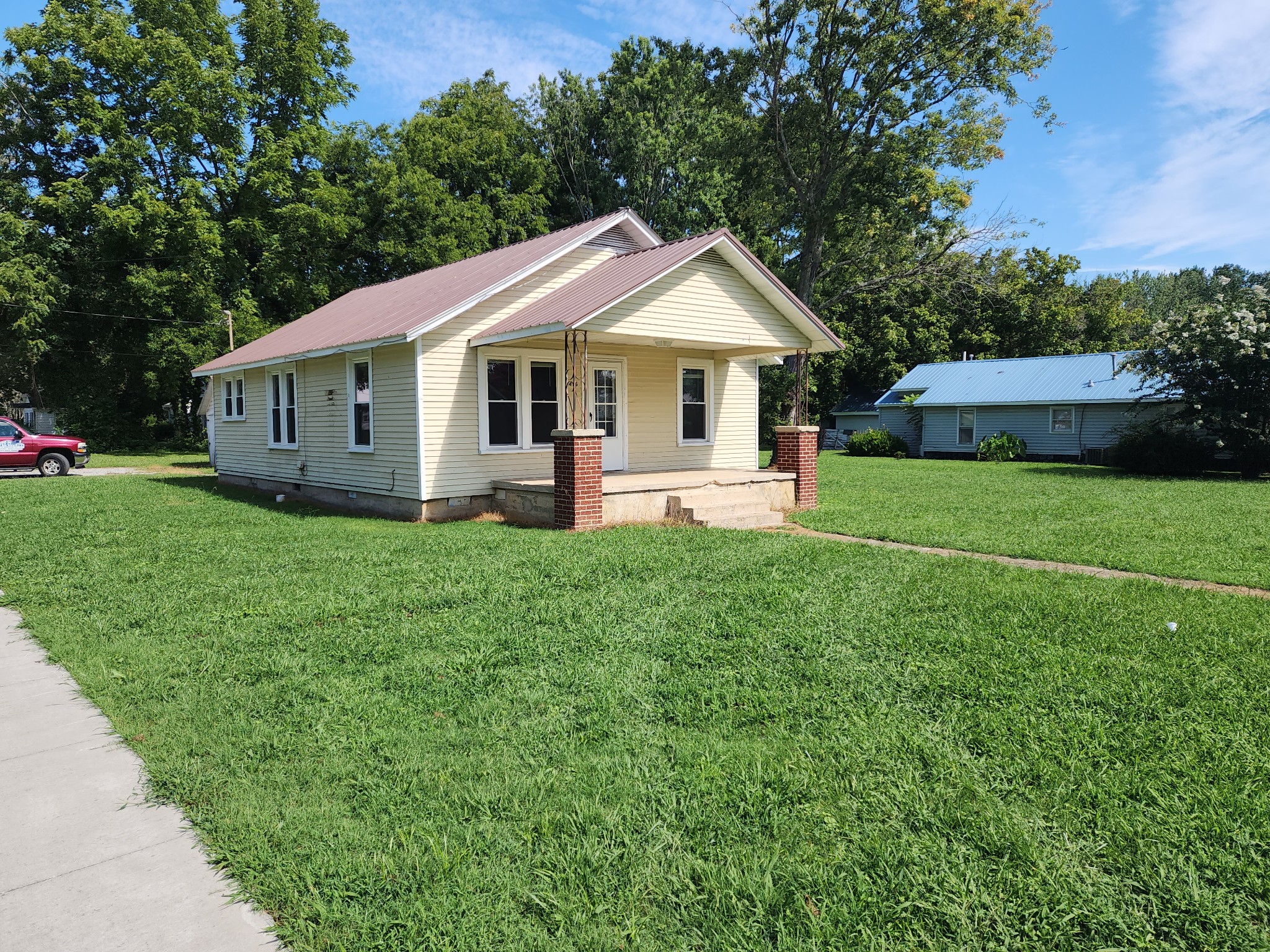 a front view of a house with garden