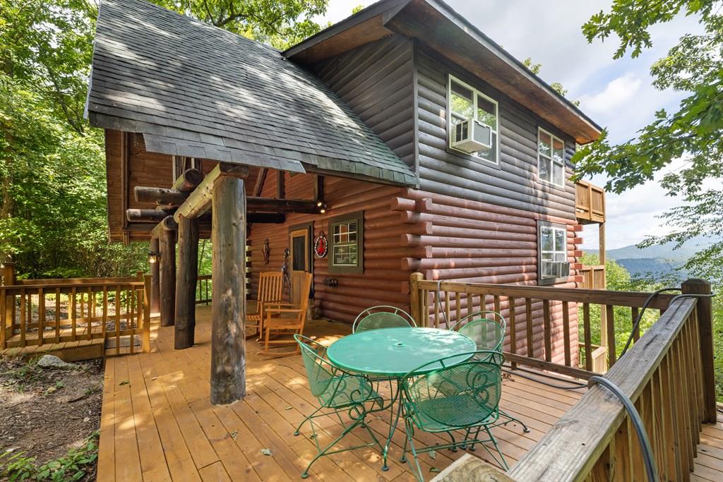 a view of a backyard with a patio and outdoor seating