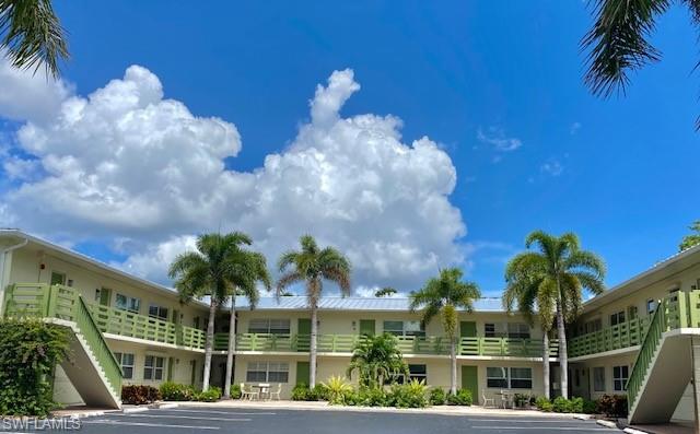 a view of palm trees in front of house