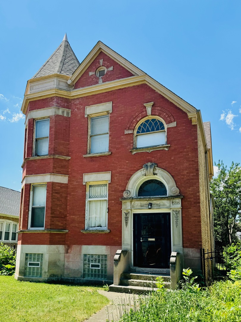 a front view of a house with yard