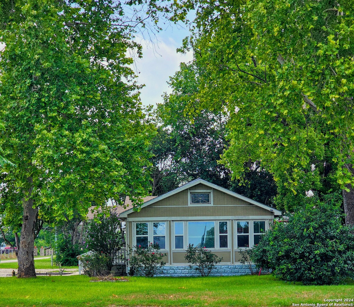 a front of a house with a yard