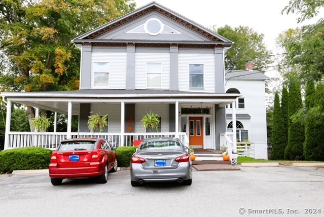 a front view of a house with parking