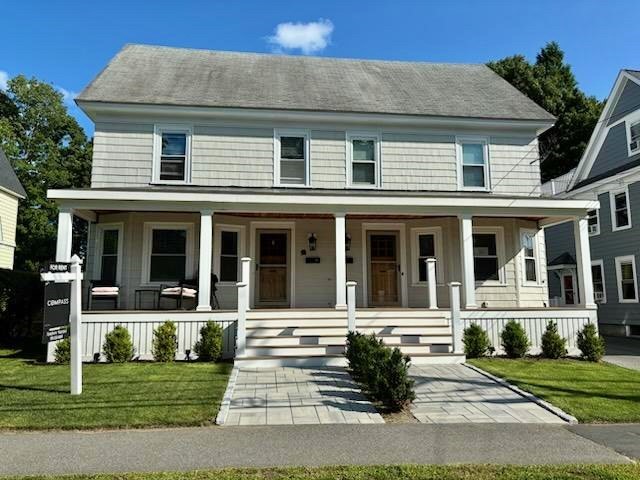 front view of a house with a yard