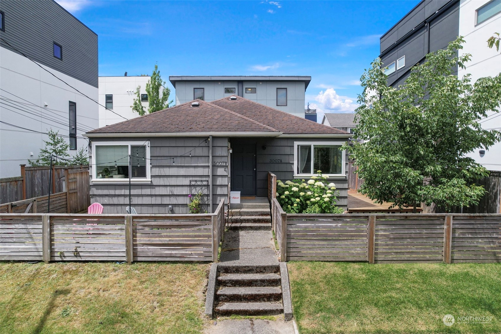 a front view of a house with garage