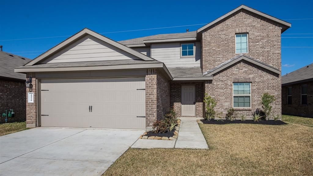 Front of home with 2-car garage attached