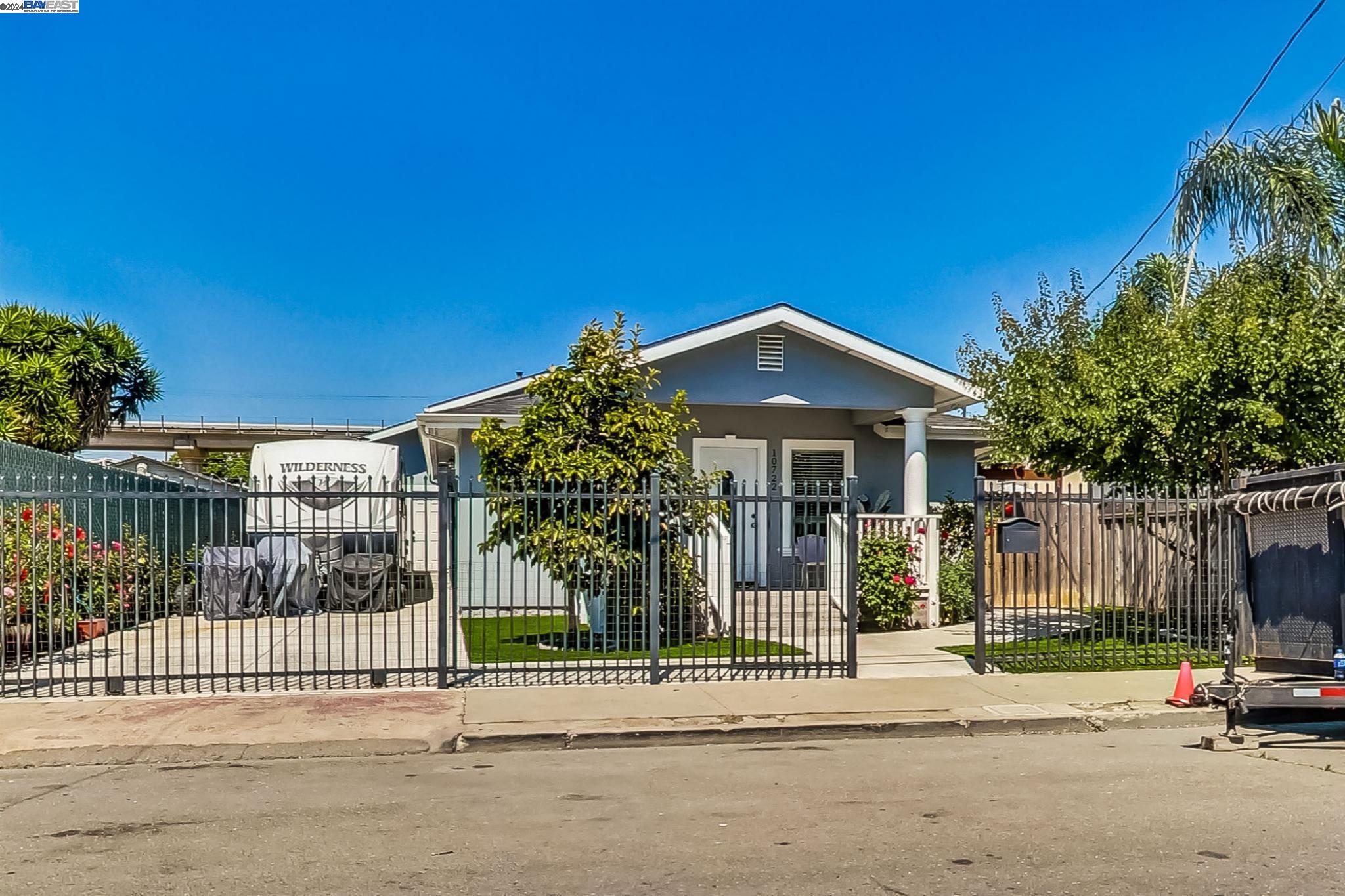 a view of a house with a iron gate