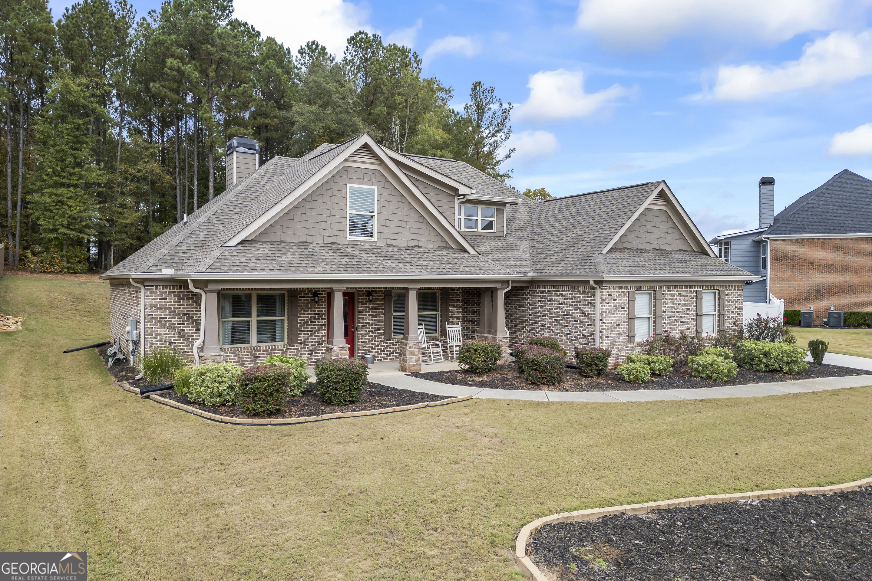 a front view of a house with a yard