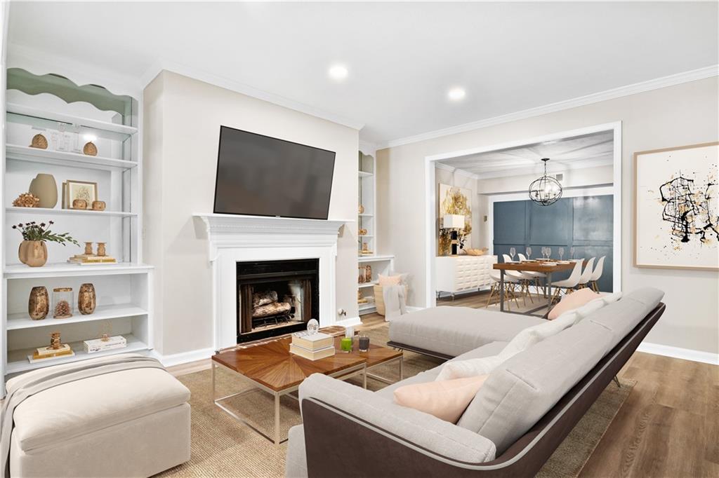 a living room with furniture fireplace and flat screen tv