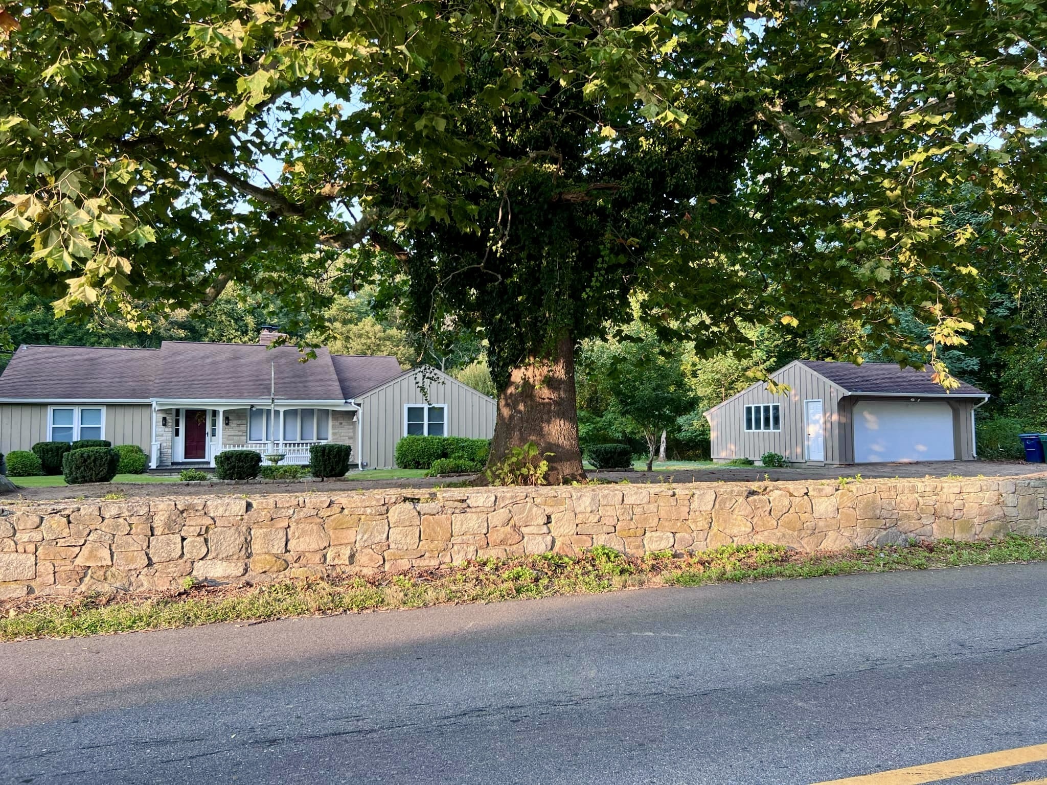 front view of a house with a small yard