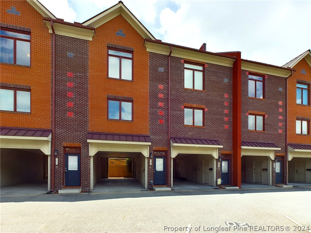 a front view of a building with many windows