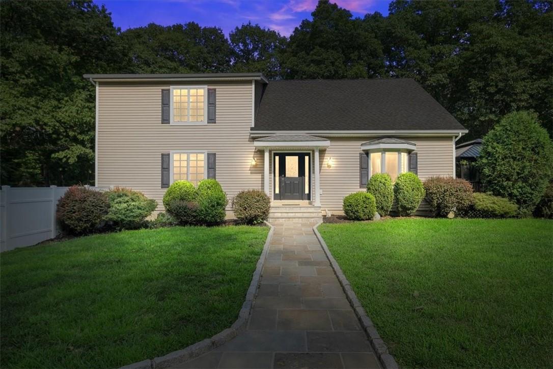 View of front of home featuring a lawn