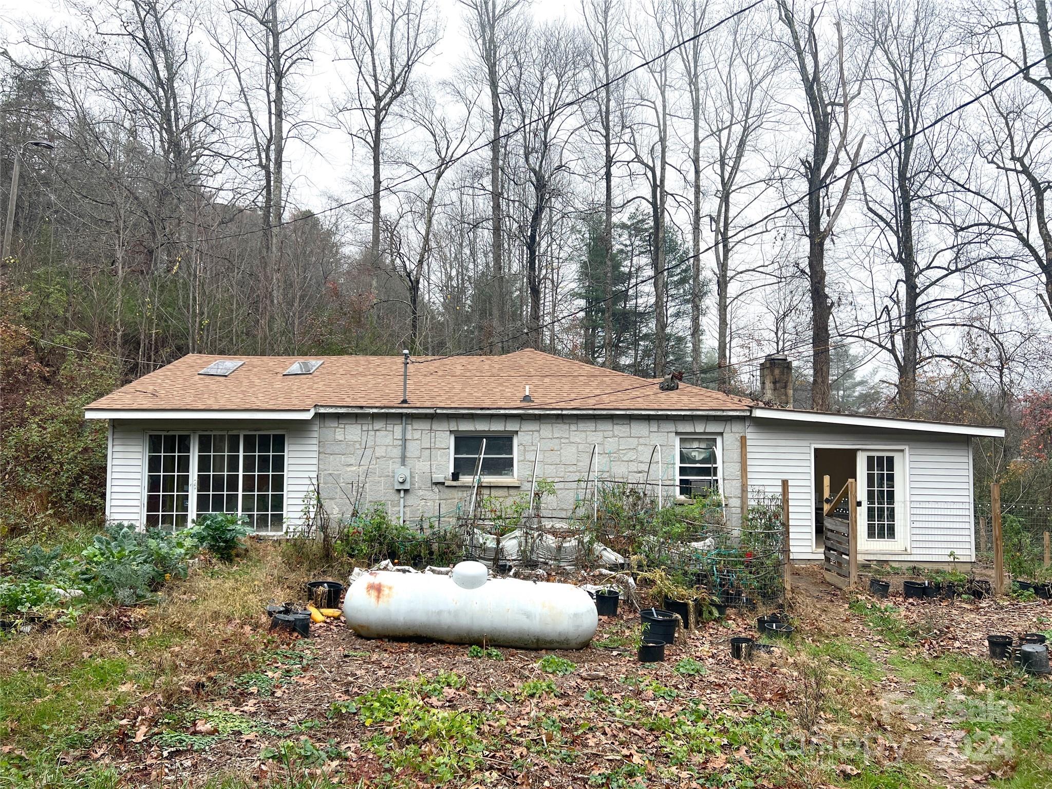 a front view of a house with patio and fire pit