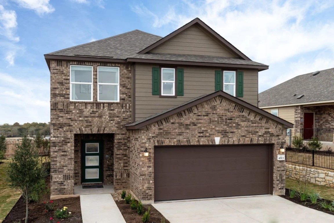 a front view of a house with yard