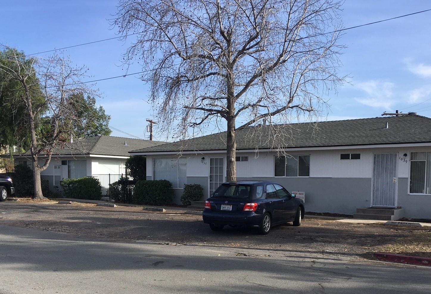 a car parked in front of a house