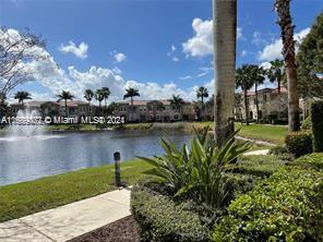 a lake view with palm trees