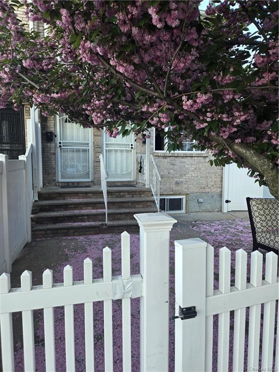 a view of a house with a small yard