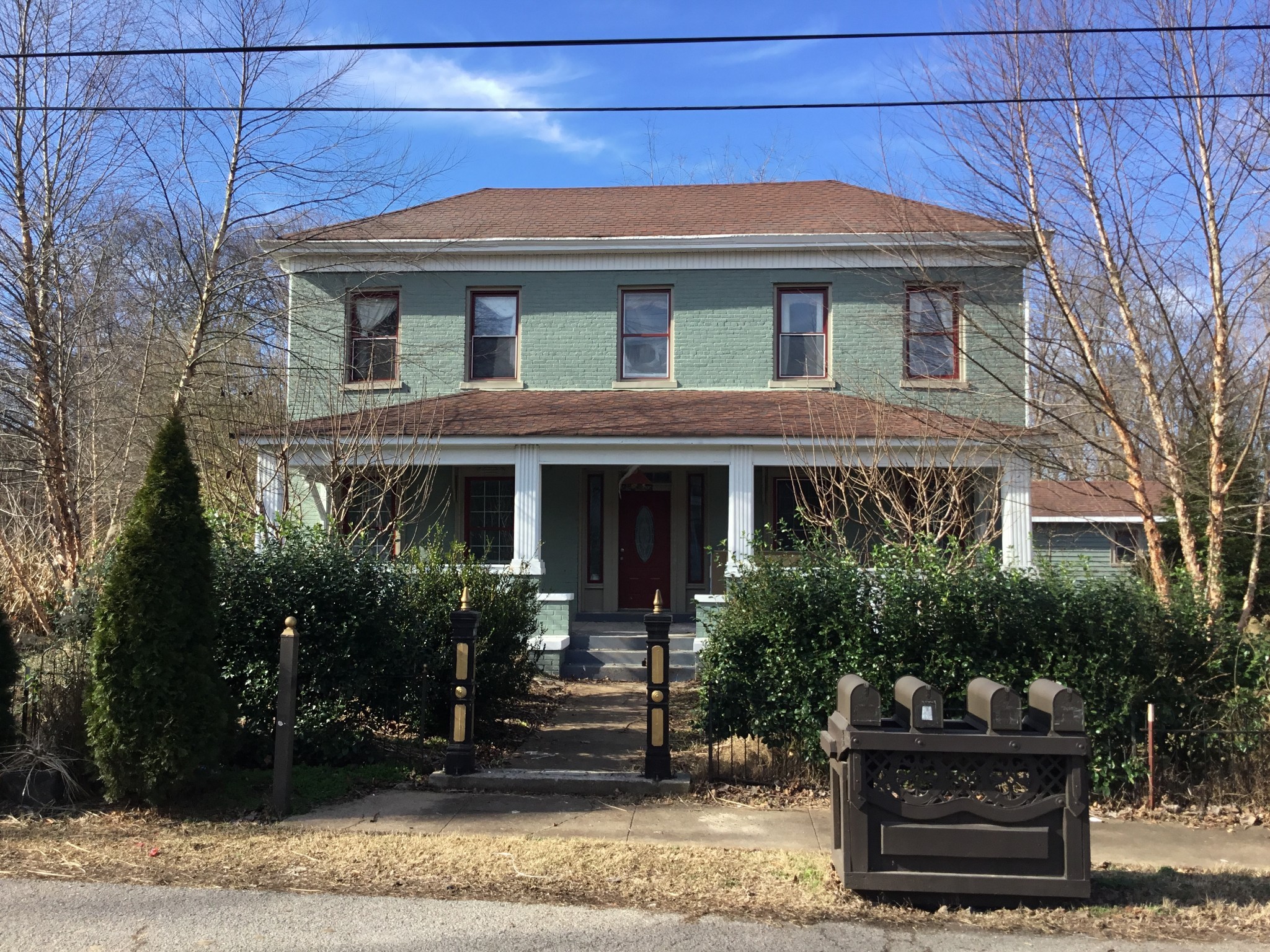 a front view of a house with garden